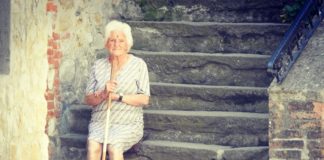 Old lady sitting on stairs