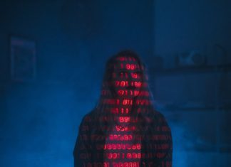 Person covered with binary code in blue background