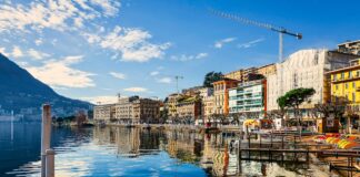 Picturesque image showing lake and houses in Switzerland