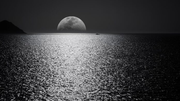 White and Black Moon With Black Skies and Body of Water Photography during Night Time