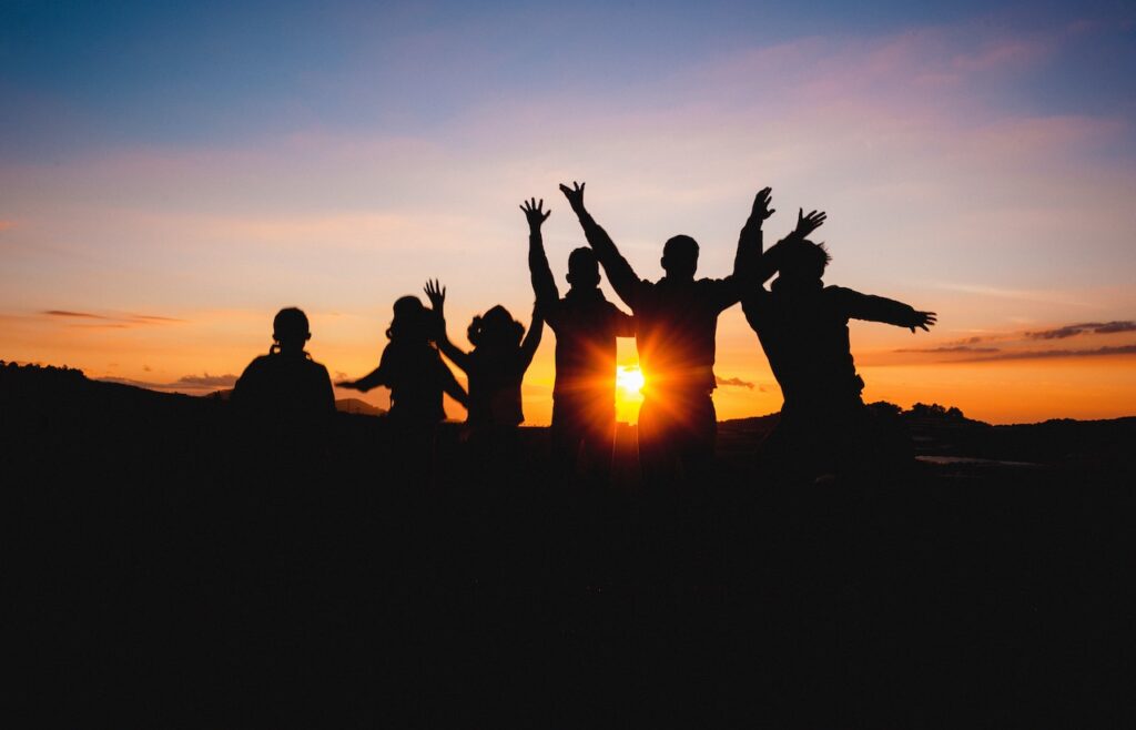 Group of  Jumping in Sunset
