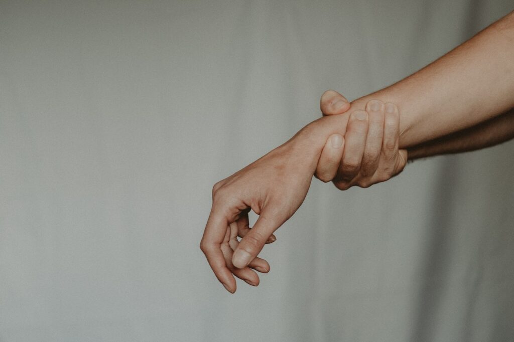 Unrecognizable person holding hand of partner 
