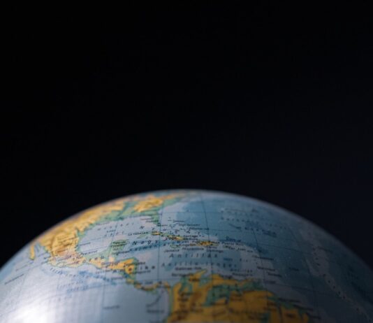 Earth Desk Globe Against Black Background