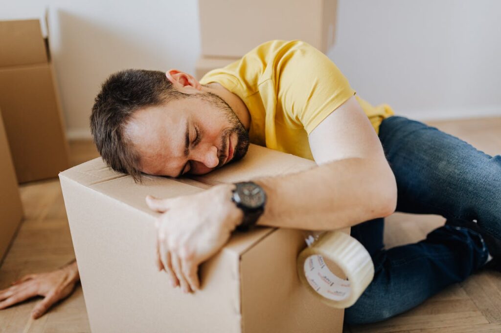 Person sleeping on a box