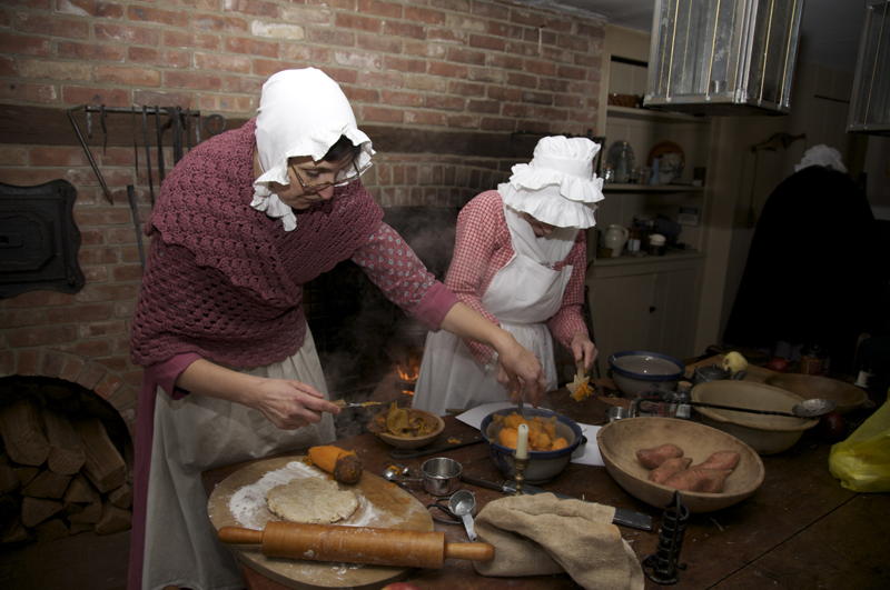 Two women preparing food