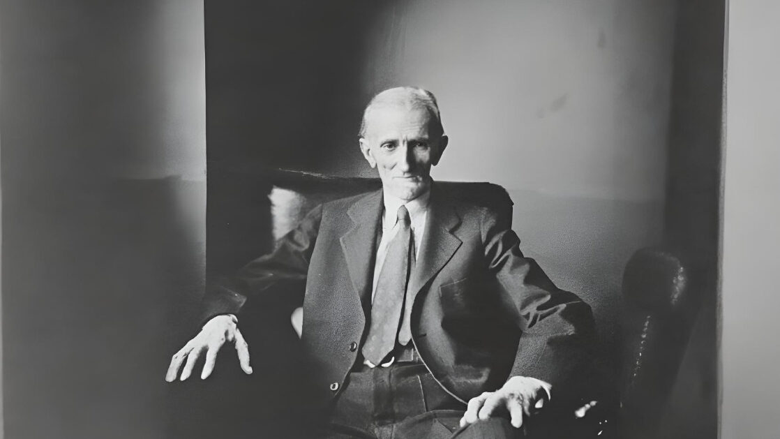 Old Nikola Tesla sitting in a chair