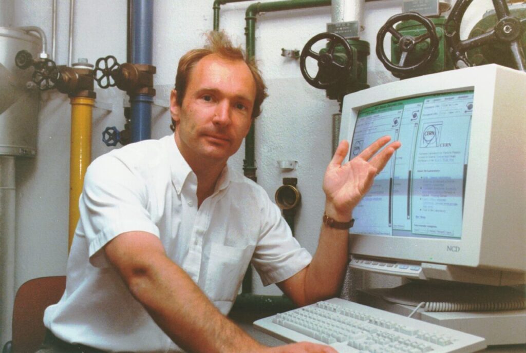 Tim Berners Lee by computer
